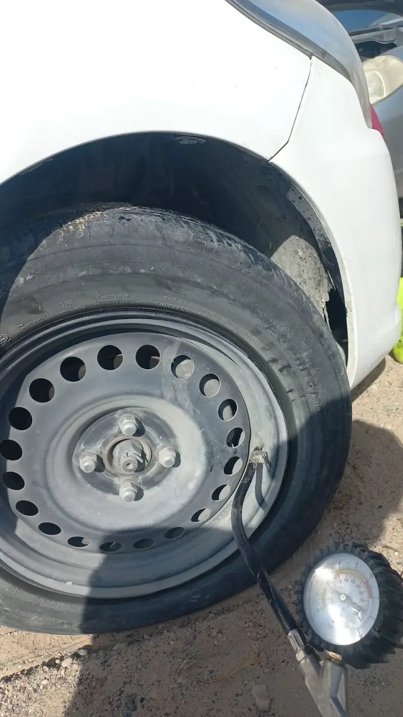 Spare steel wheel being fitted